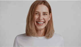 Smiling woman with bright white teeth after professional teeth whitening at Dorfner Dental Studio